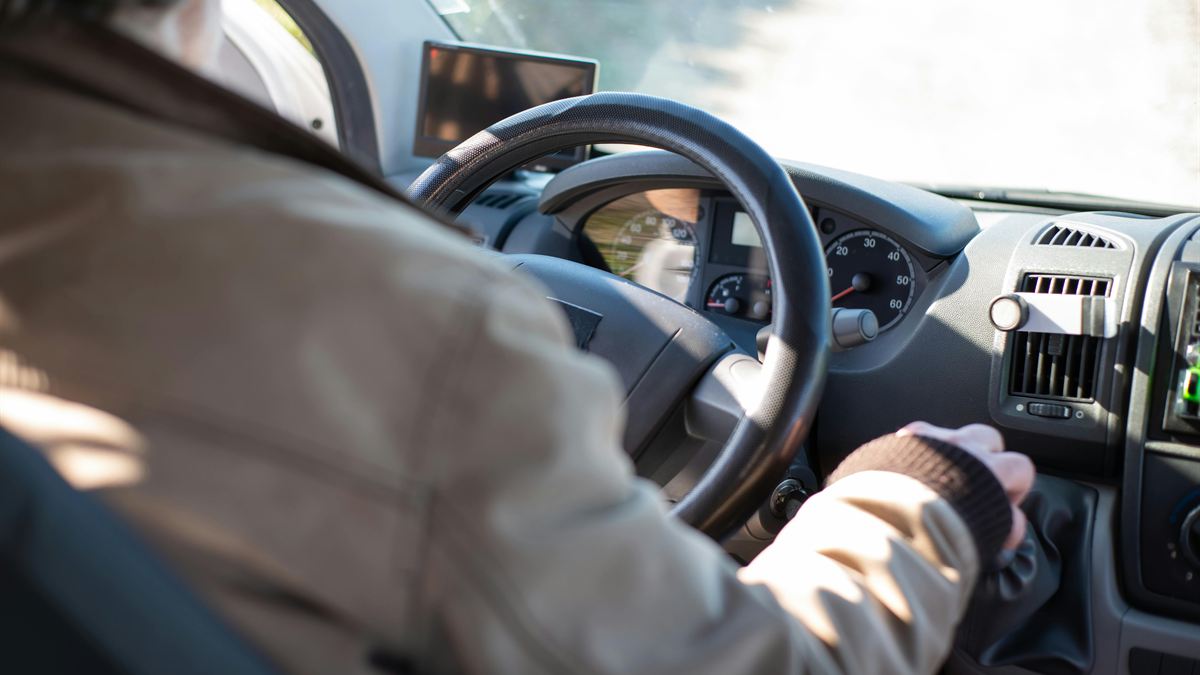 Support worker's hands on the wheel while driving an NDIS participant